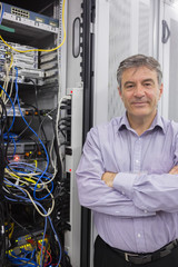Aufkleber - Technician standing beside server with folded arms