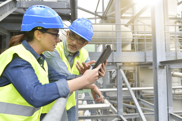 Wall Mural - Industrial engineers working in recycling plant with tablet