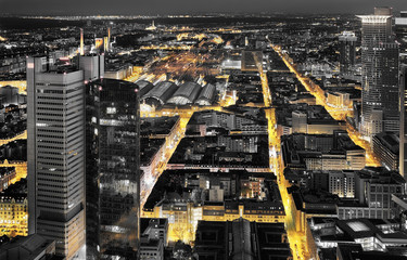 Wall Mural - High quality black and white aerial panoramic view of Frankfurt, Germany at dusk. Yellow street traffic lights between the buildings.