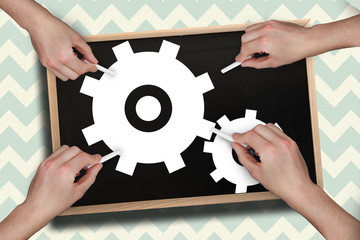 Leinwandbilder - Composite image of multiple hands drawing cogs with chalk against blackboard