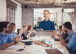 © Mediteraneo - Business people looking at projector during video conference in office