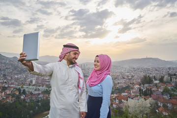 Wall Mural - Muslim couple using tablet