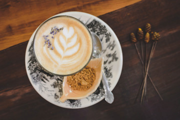 Wall Mural - Late art coffee cup on wooden table