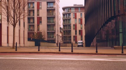 Poster - Movement of cars on the background of an office building 4k video