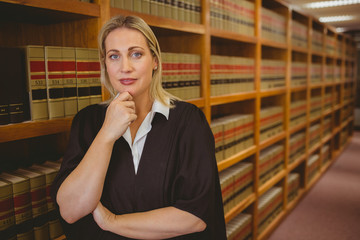 Poster - Serious lawyer thinking with hand on chin