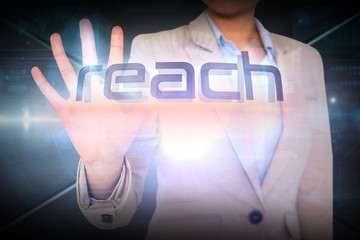 Wall Mural - Businesswoman presenting the word reach against futuristic screen with lines