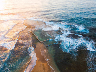 Canvas Print - sunrise light hitting mona vale rock pool. shot from above.