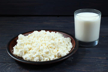 Poster - Dairy products: curd and milk on wooden background