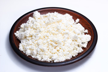 Poster - Cheeses in a plate on a white background close-up