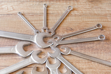 Wall Mural - A lot of wrenches. The working set of wrenches on wooden background. Tooling.