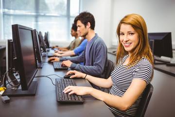 Poster - Happy student in computer class smiling at camera