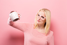 Young Woman With No More Coffee In Her Empty Mug