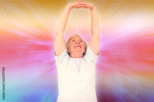 Senior woman stretching her arms against abstract background Poster