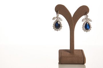 Wall Mural - Diamond earrings with sapphires. Beautiful luxury jewelry, close-up