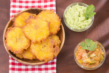 Canvas Print - Patacón fried flattened pieces of green plantain (tostón, tachino)