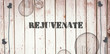 canvas print picture - The word rejuvenate  against wooden background with plugs