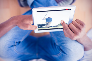 Poster - Golf player taking a shot against businessman using digital tablet in creative office