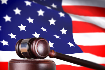 Poster - Hammer and gavel against highly detailed 3d render of an american flag