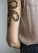 © Rawpixel.com - Closeup of arm tattoo of a woman