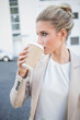 © WavebreakmediaMicro - Relaxed stylish businesswoman drinking coffee