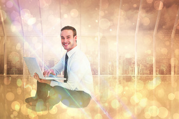 Poster - happy businessman sitting and using laptop against room with large window looking on city