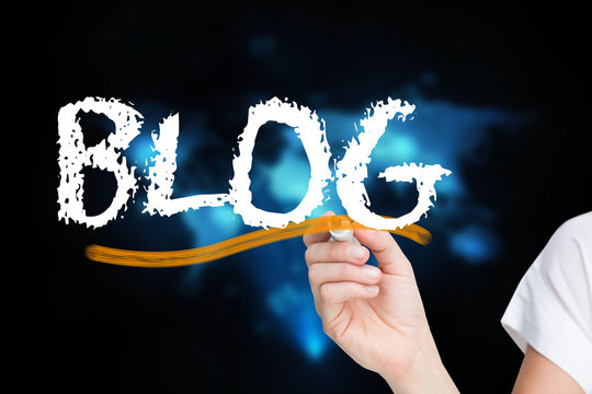 Businesswoman writing the word blog against futuristic technology interface