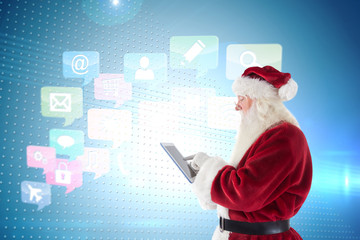 Wall Mural - Santa uses a tablet PC against technical screen with pixels 