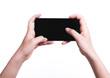 © sorapop - Female hand holding mobile smartphone play game gamer blank black screen