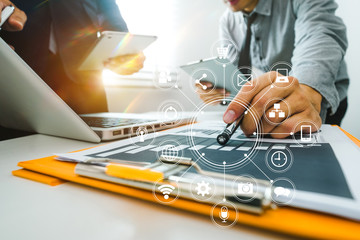 Team business meeting presentation. Hand businessman working   project in modern office.Laptop computer and tablet and smart phone on white desk in morning light