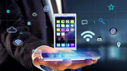 Poster - Businessman using a smartphone with a tablet surrounding by app and social icon - 3d render