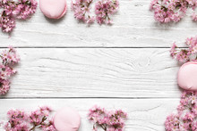 Creative Layout Made With Pink Cherry Blossom Flowers On White Wooden Background. Flat Lay. Top View. Wedding Frame