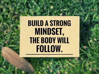 Motivational and inspirational quotes - Build a strong mindset, the body will follow. With vintage styled background.