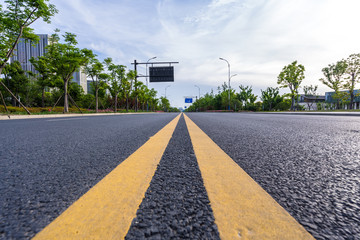 empty asphalt road with modern building 