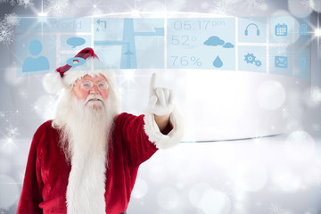 Wall Mural - Santa Claus points at something against snowflakes in room