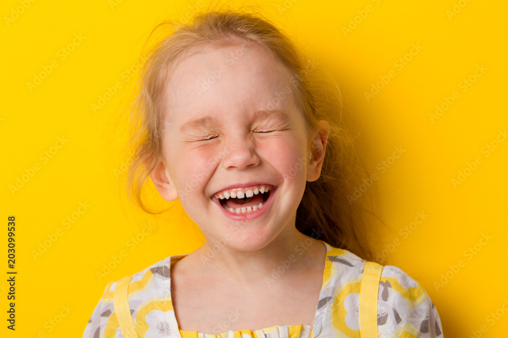 Cheerful girl laughs