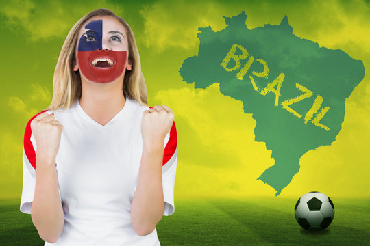 Excited chile fan in face paint cheering against football pitch with brazil outline and text