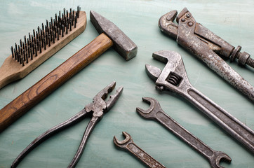 old tools set on a painted board