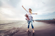 © Mediteraneo - Happy couple in love on beach summer vacations. Joyful girl piggybacking on young boyfriend having fun.