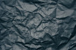 © burdun - black wrinkled paper texture.