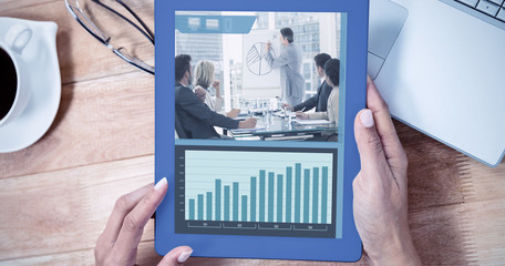 Poster - Screen with graphs against overhead of feminine hand using tablet
