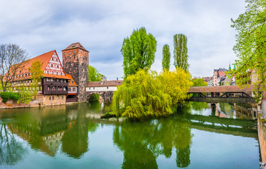 Historical old town with view of Weinstadel, bridge and Henkerturm tower in Nurnberg, Germany.