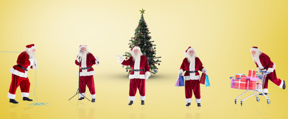 Wall Mural - Composite image of different santas against yellow vignette