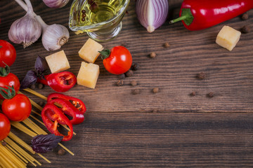 Wall Mural - Ingredients for cooking spaghetti - raw pasta, tomato, olive oil, spices, herbs