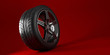 Car wheel isolated on a red background. Tyre. Poster design. 3d illustration