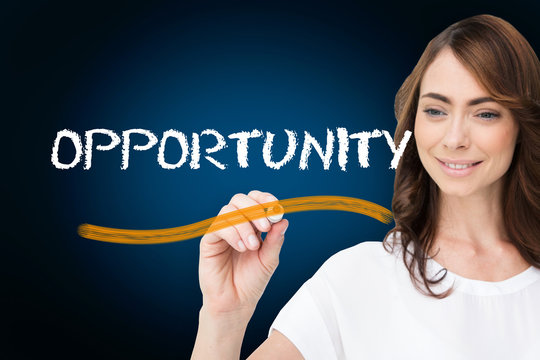Businesswoman writing the word opportunity against blue background with vignette