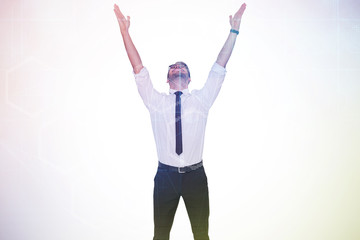 Poster - Smiling businessman cheering with his hands up against digitally generated server room with towers