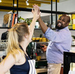 © Rawpixel.com - Colleagues give a high five to each other