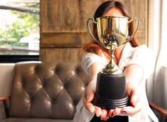 Wall Mural - trophy hold on working women 's hands