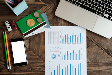 Wall Mural - Accounting concept. financial sheet and coin on desk. top view.