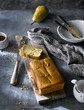 © ADDICTIVE STOCK - Flay lay of served freshly baked pear cake with tea on rustic table.